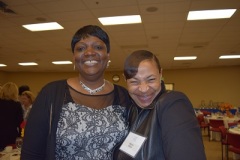 Client speaker Lavetta Ricks (l) with Marsha Wilson, WHRC colleague and friend