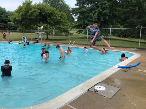 Esperanza Center students from ESOL enjoy a swim summer of 2019.