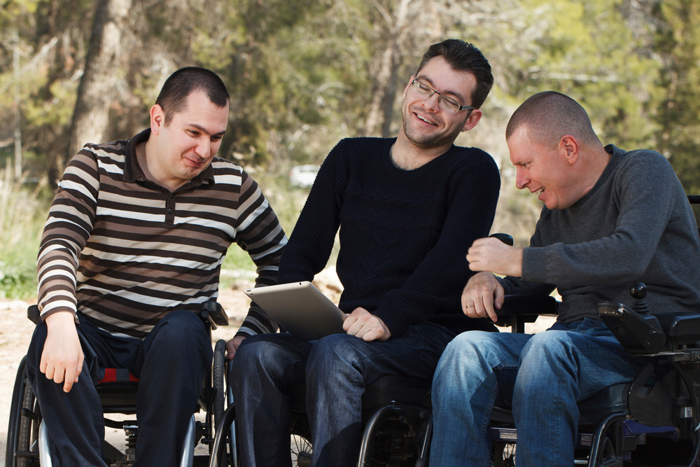 Three young men using wheelchairs at Gallagher