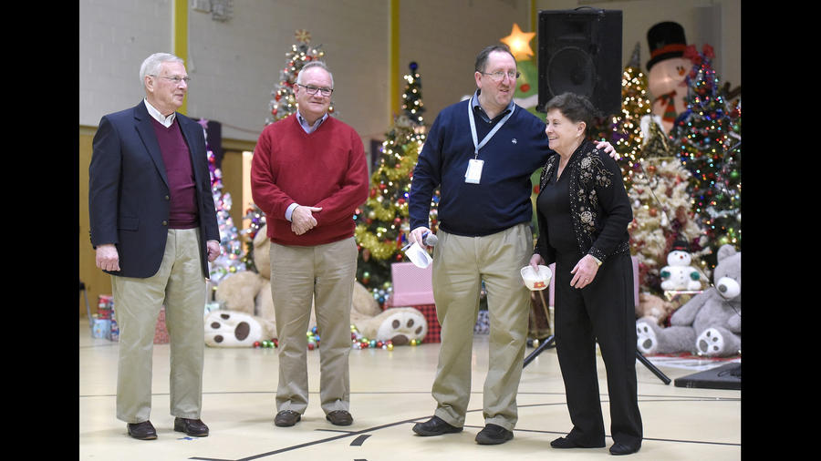 Christmas was full of joy at St. Vincent's Villa, our residential treatment Cntr for children, thanks to volunteers like Geri and Bob Olsen. At a Christmas sing-along Exec. Dir. Bill McCarthy along with St. Vincent's Villa Administrator Ezra Buchdahl honored the Olsens.