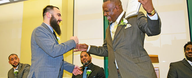 Hadi Sadeghiasl receives his certificate from case manager and Christopher Place graduate Jerry Pryor.