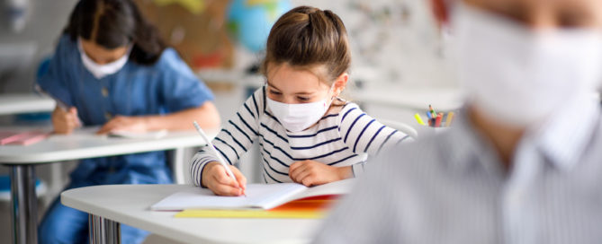 young students masked in school